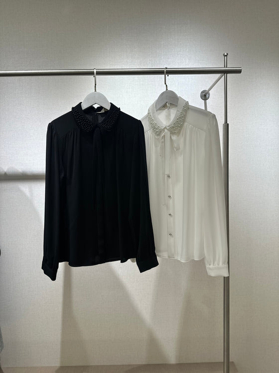 Black shirt with pearl