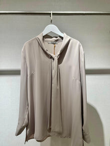  Beige shirt with ribbon