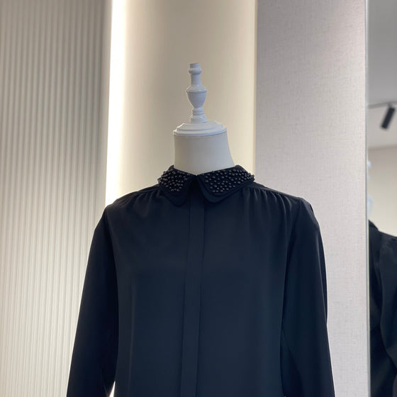 Black shirt with pearl